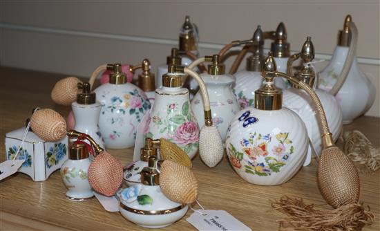 Sixteen ceramic perfume atomisers, mostly decorated with flowers